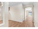 Light and bright entryway with wood flooring leading to the living areas at 200 Fairmont Dr, Spring Hill, FL 34609