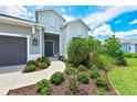 House exterior with landscaping and walkway at 13769 Old Creek Ct, Parrish, FL 34219