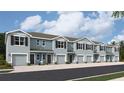 Three-story townhouses with two-car garages and modern exterior at 4317 Red Banks Ln, Bradenton, FL 34208