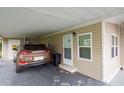 Tan mobile home with carport at 7154 El Meyers St, Zephyrhills, FL 33541