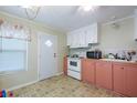 Pink and white kitchen with appliances at 7154 El Meyers St, Zephyrhills, FL 33541