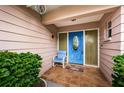 Inviting front entrance with a bright blue door and welcoming mat at 11705 66Th N Ave, Seminole, FL 33772