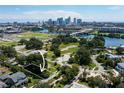 Aerial view showcases a vacant lot with a downtown cityscape in the background at 2203 Glenwood, Tampa, FL 33602