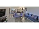 Bright living room with comfy sofas, a coffee table, and large windows at 29129 S Bay Hollow S Dr # 3213, Wesley Chapel, FL 33543