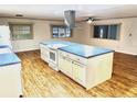 Modern kitchen with an island and stainless steel appliances at 9790 66Th N St # 196, Pinellas Park, FL 33782