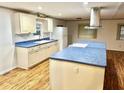 Updated kitchen featuring a large island and blue countertops at 9790 66Th N St # 196, Pinellas Park, FL 33782