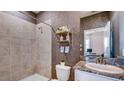 Bathroom with shower, toilet and granite vanity at 4302 Pullet Ct, Lakewood Ranch, FL 34211