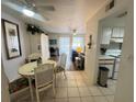 Condo dining area with table, chairs, and view of living area at 3730 42Nd S Way # H, St Petersburg, FL 33711