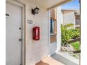 The condo entrance shows the unit number and a fire extinguisher outside the unit front door at 621 99Th N Ave # 102, St Petersburg, FL 33702