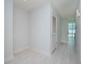 Empty hallway with light walls and tile floor at 1208 E Kennedy Blvd # 715, Tampa, FL 33602