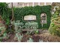 Harbour Place City Homes building signage with lush greenery at 501 Knights Run Ave # 1215, Tampa, FL 33602
