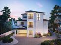 Three-story house with a garage and a landscaped front yard at 625 80Th Ave, St Pete Beach, FL 33706