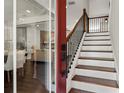 Entry with red door and modern staircase at 2820 N Central Ct, Tampa, FL 33602