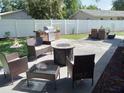 Outdoor patio with seating, fire pit, and grill at 3118 Palm Ct, Dunedin, FL 34698