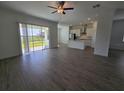 Spacious living area with sliding glass doors to backyard at 7045 E 113Th Ct, Palmetto, FL 34221