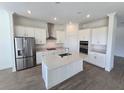 Modern kitchen with stainless steel appliances and island at 7045 E 113Th Ct, Palmetto, FL 34221