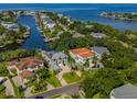 Aerial view of waterfront homes, showing canals, and lush greenery at 2509 N Dundee St, Tampa, FL 33629
