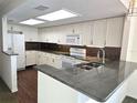 Kitchen with granite countertops and stainless steel appliances at 346 Madeira Cir, St Petersburg, FL 33715