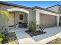 House exterior showcasing walkway and front entrance at 16762 Delia St, Wimauma, FL 33598