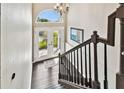 Bright and spacious entryway with double doors and staircase at 6241 Bayside Dr, New Port Richey, FL 34652