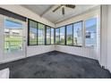 Spacious Florida room with plenty of windows and a view of the backyard at 37601 Neukom Ave, Zephyrhills, FL 33541