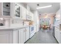 Bright and airy kitchen with white cabinets and modern appliances at 37601 Neukom Ave, Zephyrhills, FL 33541