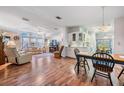 Open concept living area with hardwood floors and ample natural light at 37601 Neukom Ave, Zephyrhills, FL 33541
