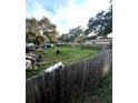 Large backyard with ample space and wooden fence at 2918 6Th S Ave, St Petersburg, FL 33712