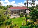 Large home with pool and screened lanai overlooking a lush backyard at 909 Shoals Landing Dr, Brandon, FL 33511
