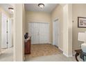 Bright and spacious entryway with tile flooring and access to other rooms at 9343 Rolling Circle, San Antonio, FL 33576