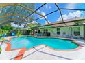 Relaxing screened pool and patio with lush landscaping at 2011 Green Juniper Ln, Brandon, FL 33511