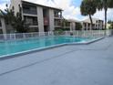 Community pool with a spacious deck at 3845 S Lake Dr # 192, Tampa, FL 33614