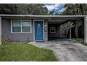 Gray house with blue door and carport at 3751 38Th N Ave, St Petersburg, FL 33713