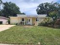 Attractive single-Gathering home with a cozy front porch and inviting curb appeal at 1155 7Th N St, Safety Harbor, FL 34695