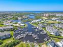 Aerial view of waterfront community with many boats and docks at 5722 Biscayne Ct # 203, New Port Richey, FL 34652