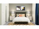 Bedroom with gray headboard and neutral color scheme at 5504 Squires Grove Ln, Wimauma, FL 33598