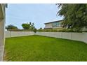 Spacious backyard with lush lawn and privacy fence at 3812 W Sevilla St, Tampa, FL 33629