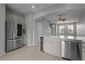 Modern kitchen with stainless steel appliances and island at 6950 Towering Spruce Dr, Riverview, FL 33578