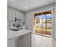 Modern kitchen with stainless steel appliances and island at 6950 Towering Spruce Dr, Riverview, FL 33578