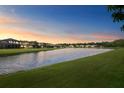 Serene lake view at sunset at 19433 Whispering Brook Dr, Tampa, FL 33647