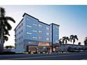 Modern building exterior, The Pearl, with parking and landscaping at 10126 Gulf Blvd # Ph1, Treasure Island, FL 33706
