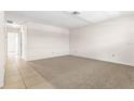 Spacious living room with carpeted floors at 2222 Greenhaven Dr, Sun City Center, FL 33573