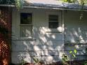 White side of house with two windows and brick chimney at 2001 15Th S Ave, St Petersburg, FL 33712