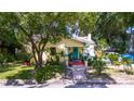 Cute yellow house with a lush green yard at 810 E New Orleans Ave, Tampa, FL 33603