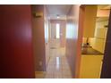 Hallway with a front door entrance and view to the kitchen space at 1601 43Rd S N St # 224, St Petersburg, FL 33713