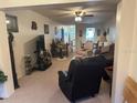 Spacious living room with comfortable seating and a view into other rooms at 1465 Normandy Park Dr # 3, Clearwater, FL 33756