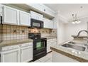 Cozy kitchen with stainless steel appliances and granite countertops at 5608 Pinnacle Heights Cir # 305, Tampa, FL 33624