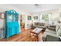 Cozy living room featuring hardwood floors and a teal secretary at 6030 62Nd N St, St Petersburg, FL 33709