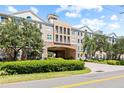 Apartment building showcasing architectural details and lush landscaping at 4221 W Spruce St # 1424, Tampa, FL 33607