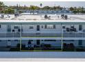 Aerial view of a condo building with a patio and parking at 5286 81St N St # 4, St Petersburg, FL 33709